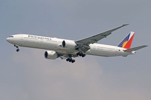 Philippines Airlines jet flying through the sky, showcasing modern aviation technology.