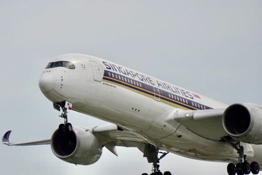 Close-up of Singapore Airlines Airbus A350 aircraft during flight, showcasing its design and engineering.