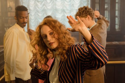 Group enjoying a retro 70s dance party with a focus on vintage fashion and atmosphere.