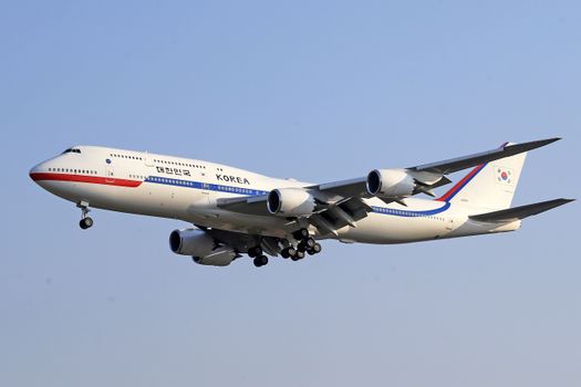 A South Korean aircraft flying against a clear blue sky.