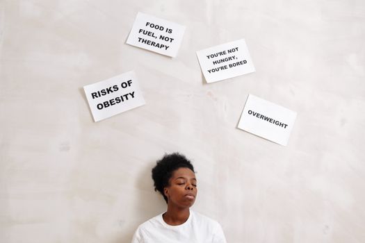 African American woman with health messages about nutrition and obesity awareness.